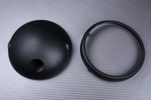 Casing for round headlight casing, to be adapted