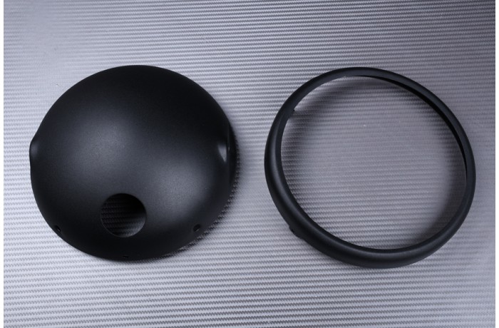 Casing for round headlight casing, to be adapted