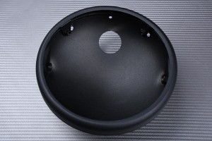 Casing for round headlight casing, to be adapted