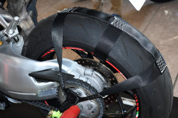 Rear wheel tie down sling